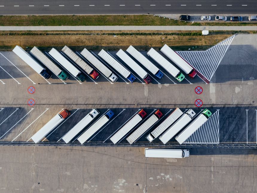Trucks and trailers lined up at a freight depot